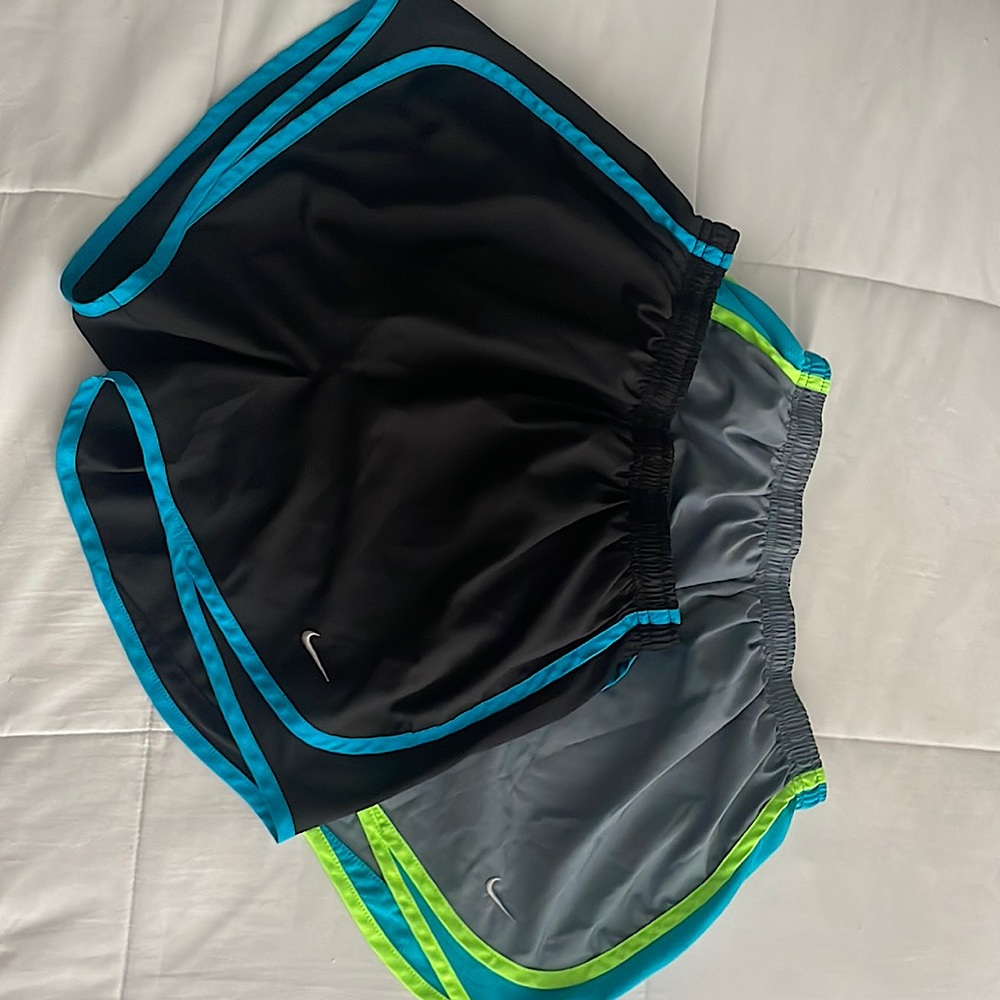 Two pairs of small Nike shorts